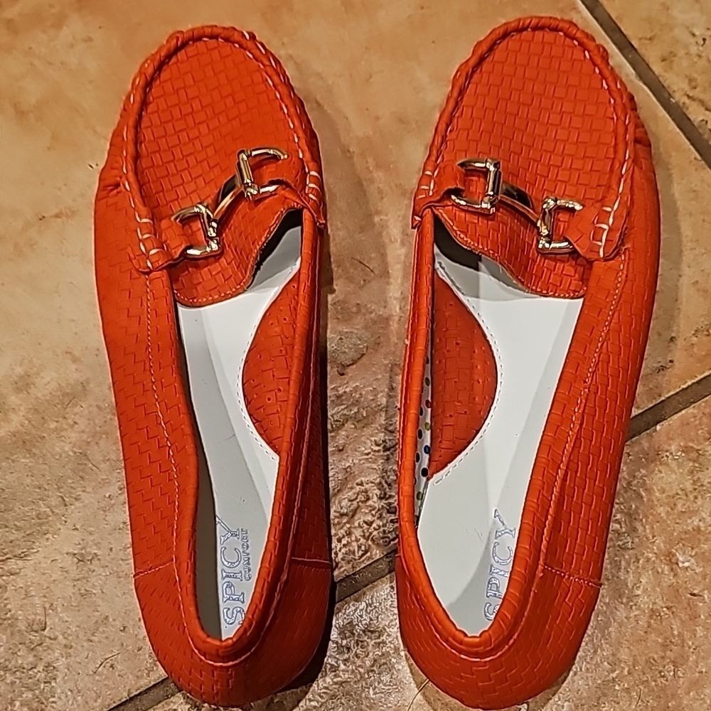 Spicy Footwear Orange Flats with Textured Surface and Decorative Metal Accent